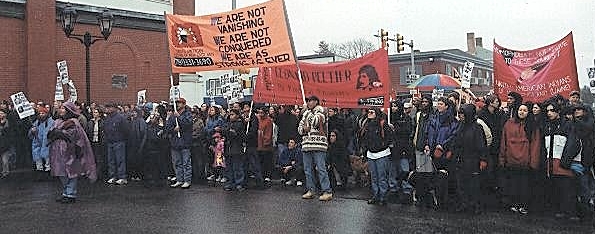 National Day of Mourning march with people holding banners